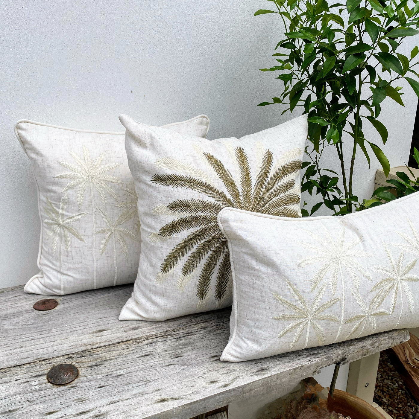 Set of three white cushion cover with palm tree design
