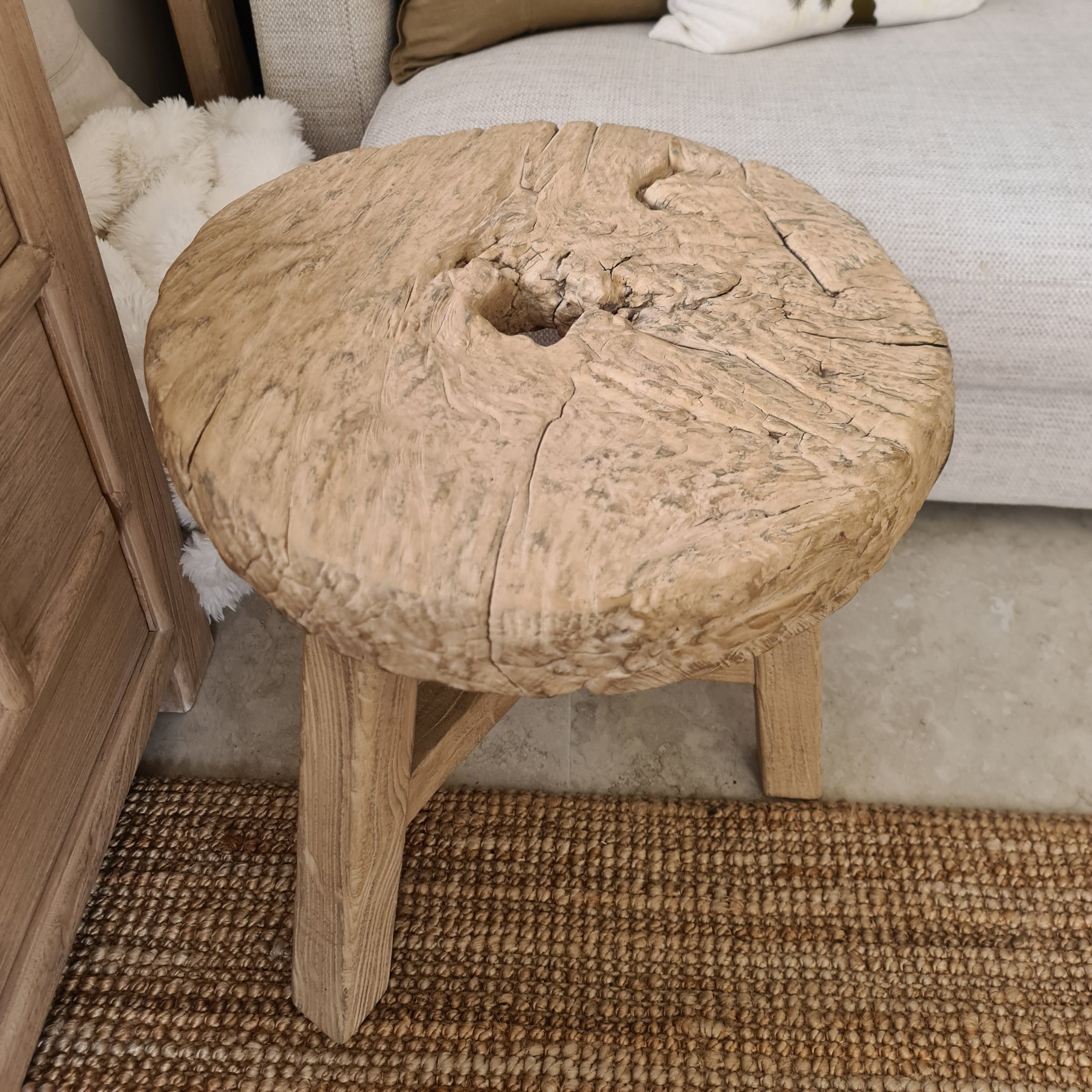 Wooden chair with a textured backrest in a home setting