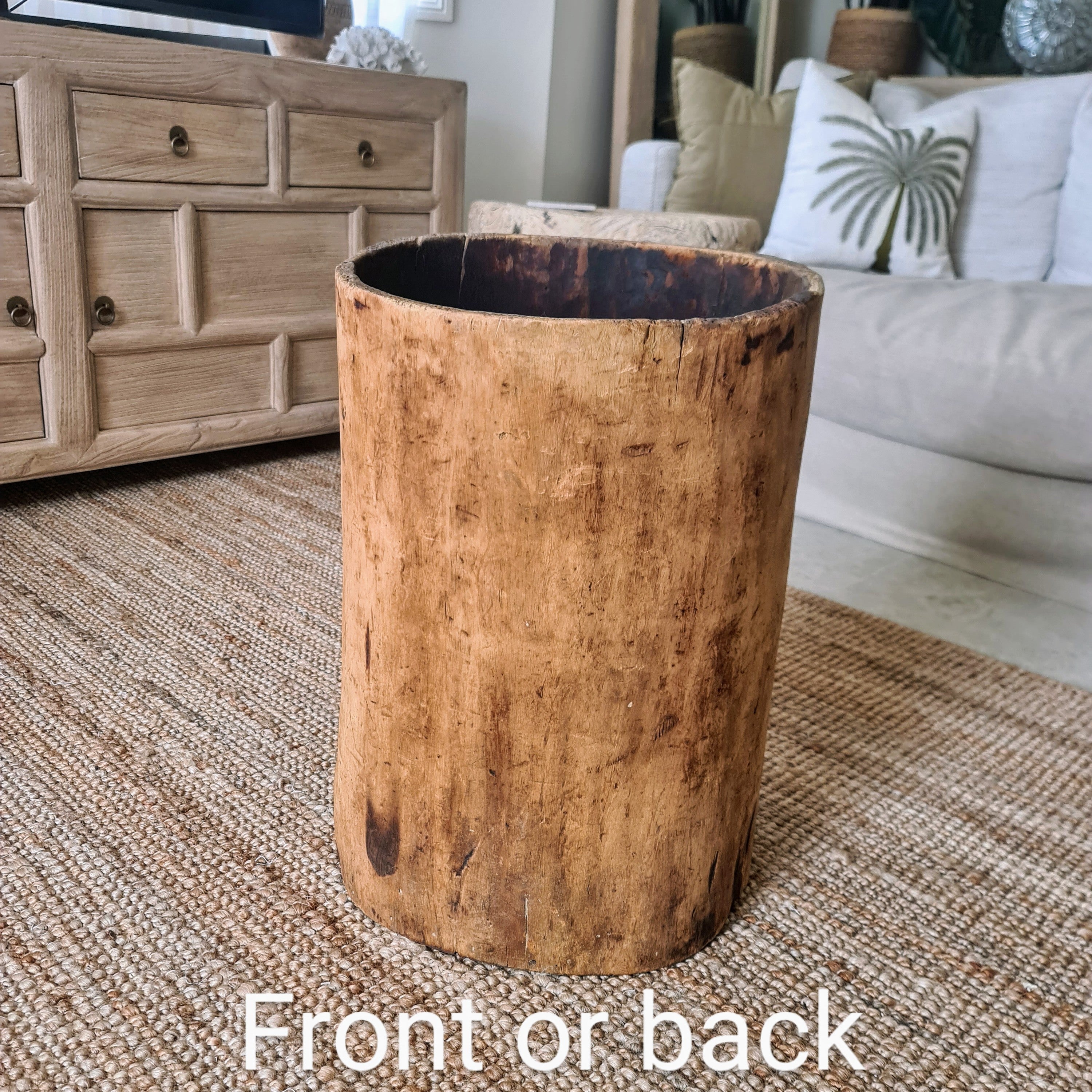 Wooden planter in a living room setting with furniture and decor.